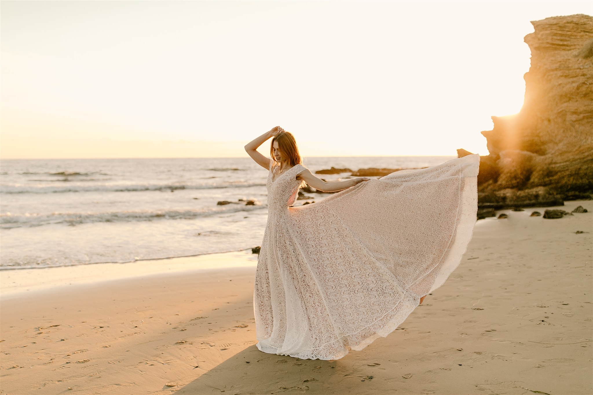Bride on California beach at sunset